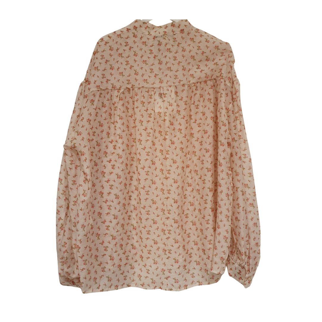 Blusa floreale over Philia Loft